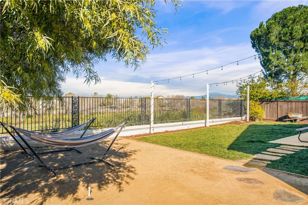 33012 Tulley Ranch Road Temecula, CA 92592 - Photo 22 of 25 a view of a swimming pool with a lounge chair