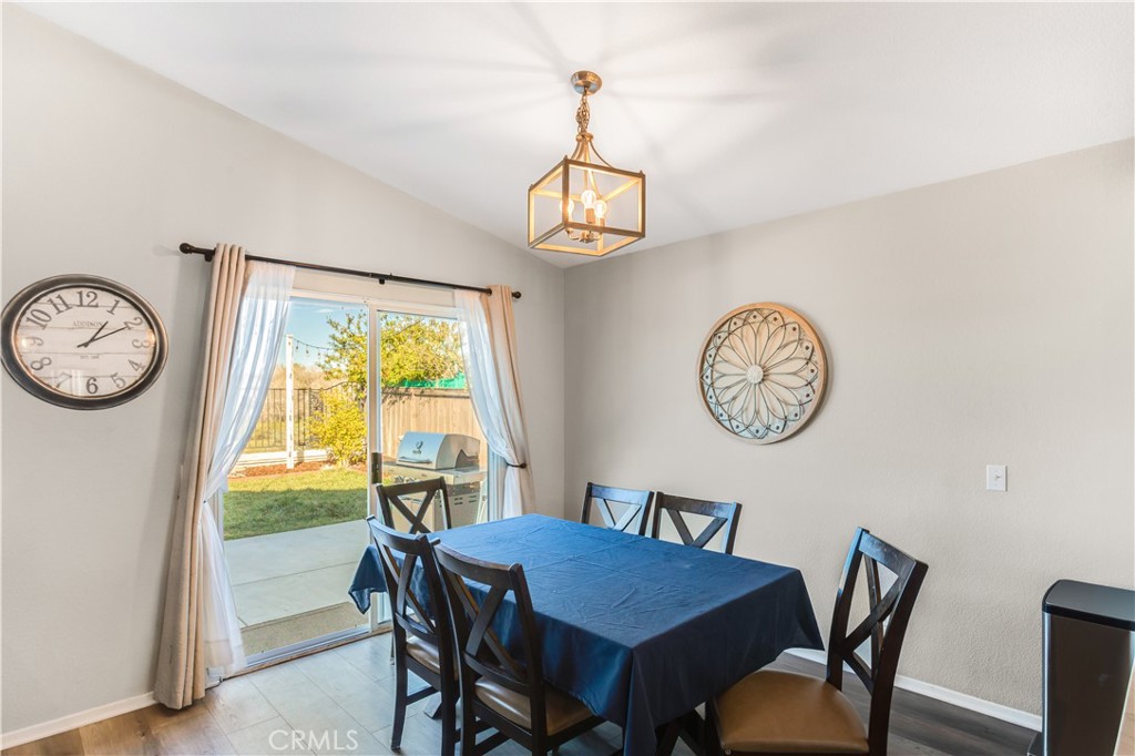 33012 Tulley Ranch Road Temecula, CA 92592 - Photo 8 of 25 a view of a dining room with furniture window and wooden floor