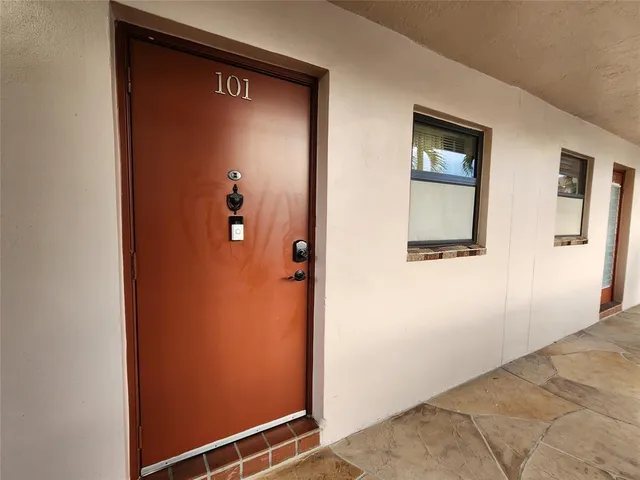 a view of a door and a window