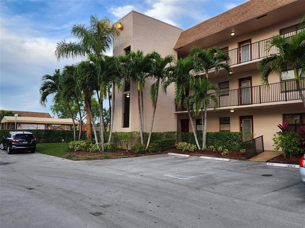 10180 Northwest 30th Court, Unit 101 Sunrise, FL 33322 - Photo 16 of 21 a view of multiple houses with a street