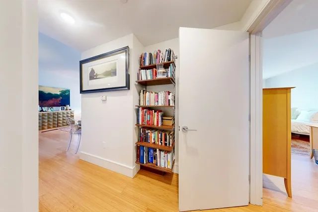 a view of a hallway with shelves