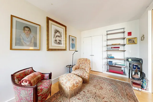 a bedroom with bed and a couch