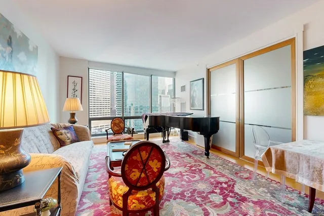 a living room with furniture and a window