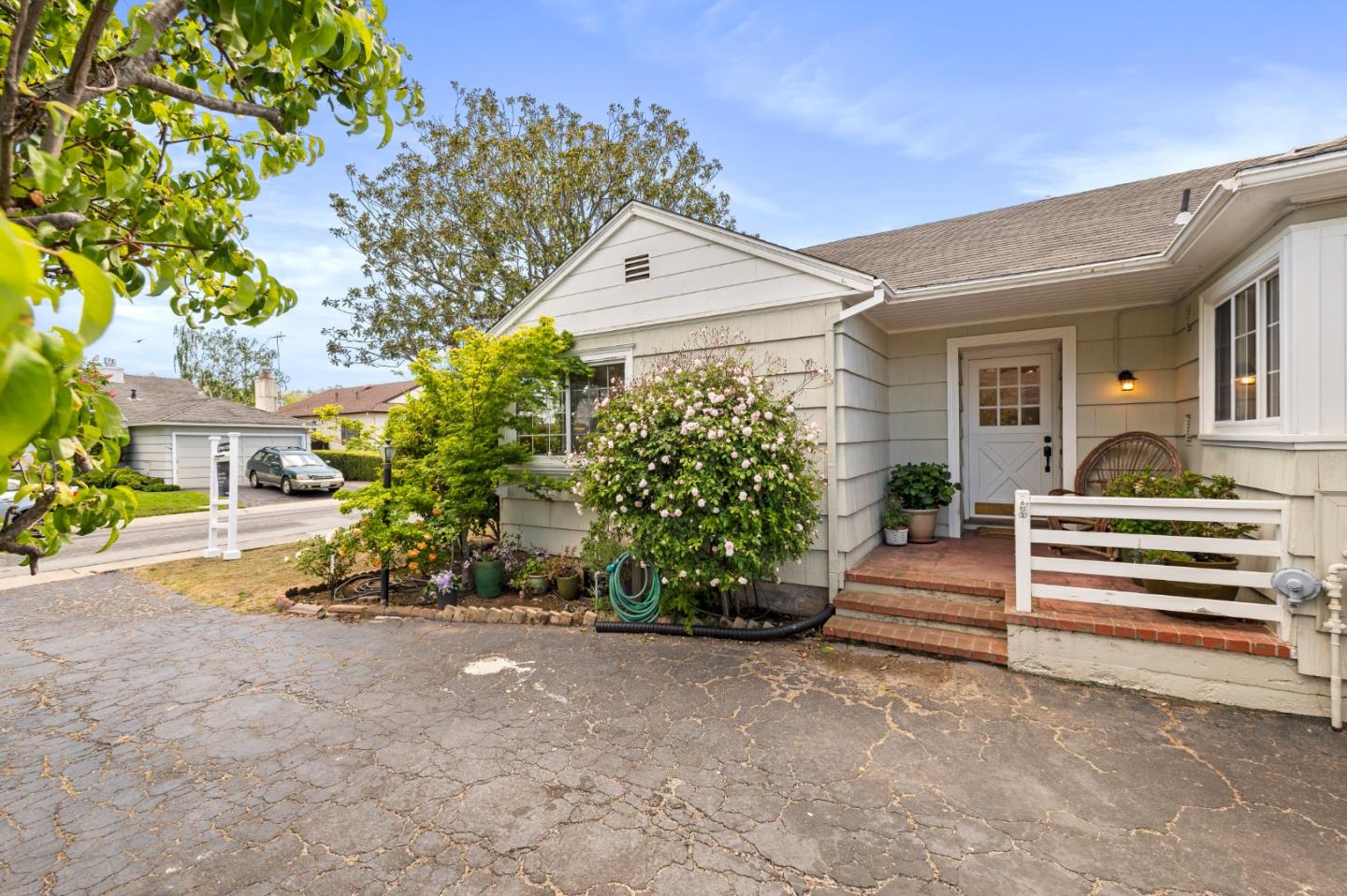 a front view of a house with a yard and a garage