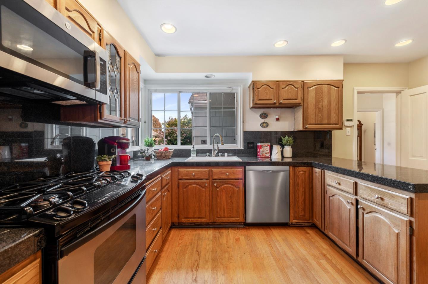114 Arrowood Lane San Mateo, CA 94403 - Photo 11 of 28 a kitchen with stainless steel appliances granite countertop a stove and a sink