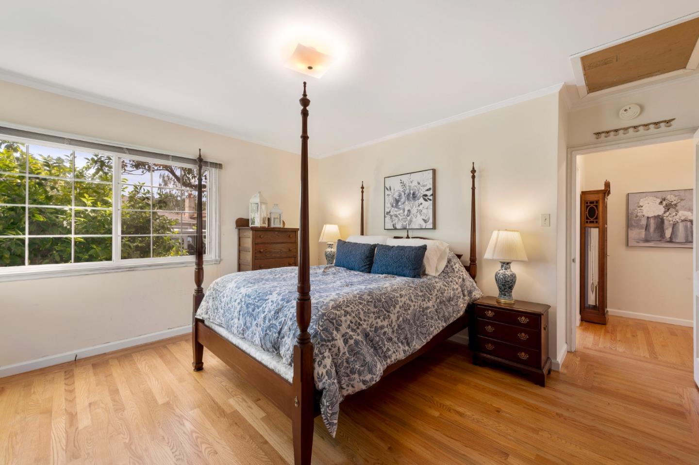 114 Arrowood Lane San Mateo, CA 94403 - Photo 14 of 28 a bedroom with a bed and wooden floor