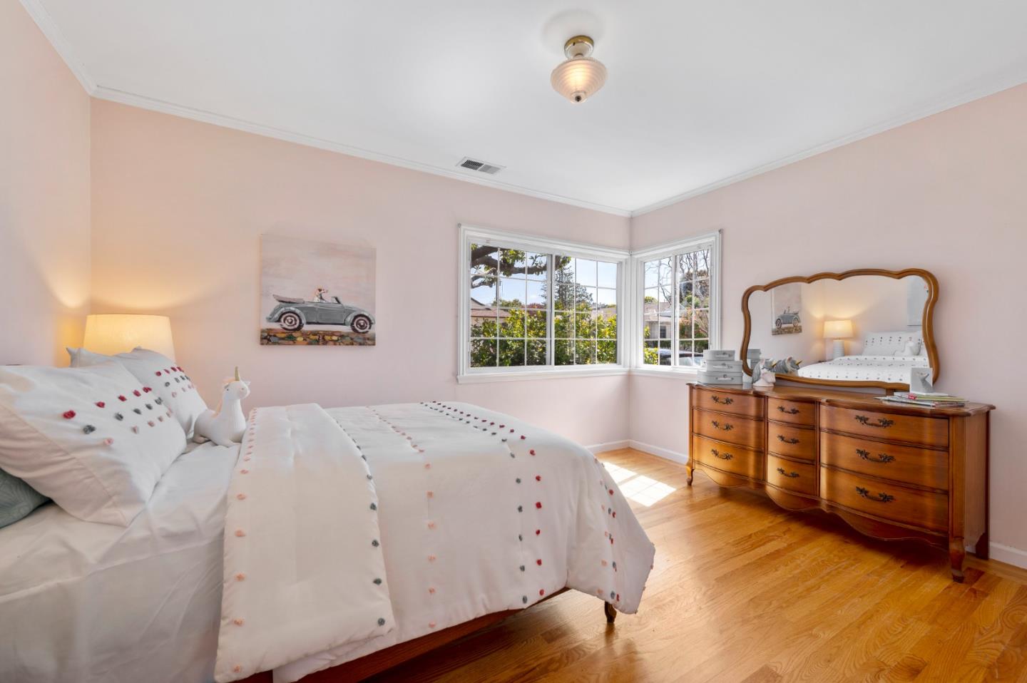 114 Arrowood Lane San Mateo, CA 94403 - Photo 17 of 28 a bedroom with a bed and wooden floor