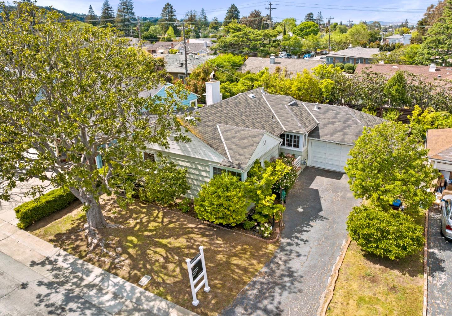 114 Arrowood Lane San Mateo, CA 94403 - Photo 23 of 28 a view of a lake with a building in the background