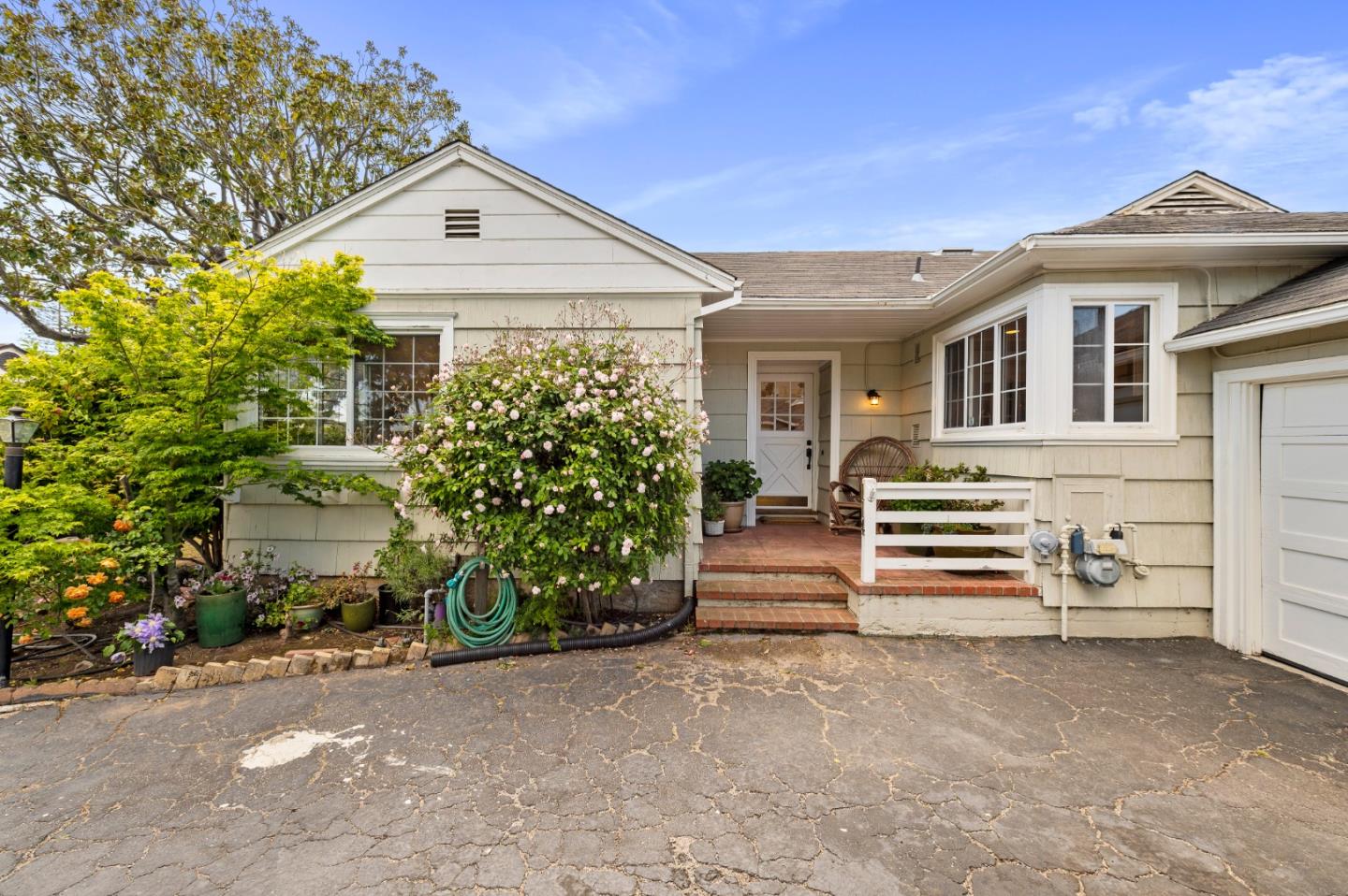 114 Arrowood Lane San Mateo, CA 94403 - Photo 3 of 28 a front view of a house with a yard