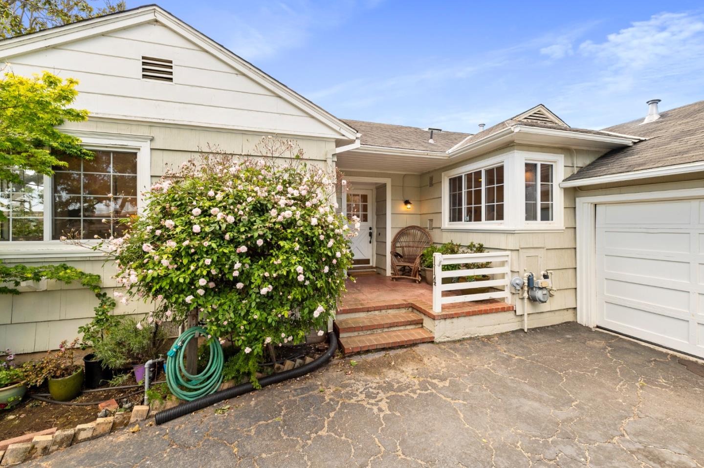 114 Arrowood Lane San Mateo, CA 94403 - Photo 4 of 28 a front view of a house with a garden