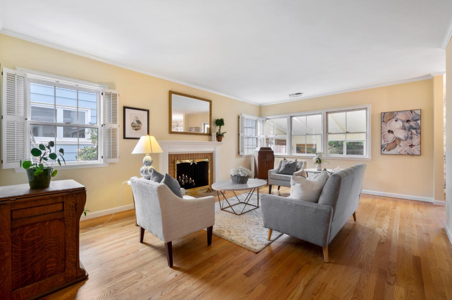 114 Arrowood Lane San Mateo, CA 94403 - Photo 7 of 28 a living room with furniture a fireplace and a table