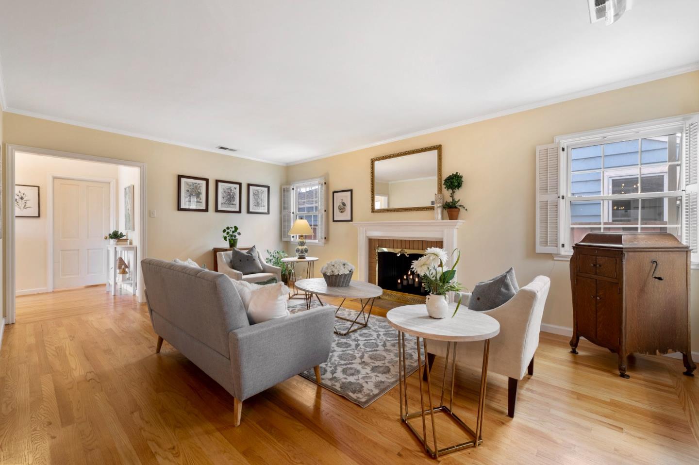 114 Arrowood Lane San Mateo, CA 94403 - Photo 8 of 28 a living room with furniture a fireplace and a table