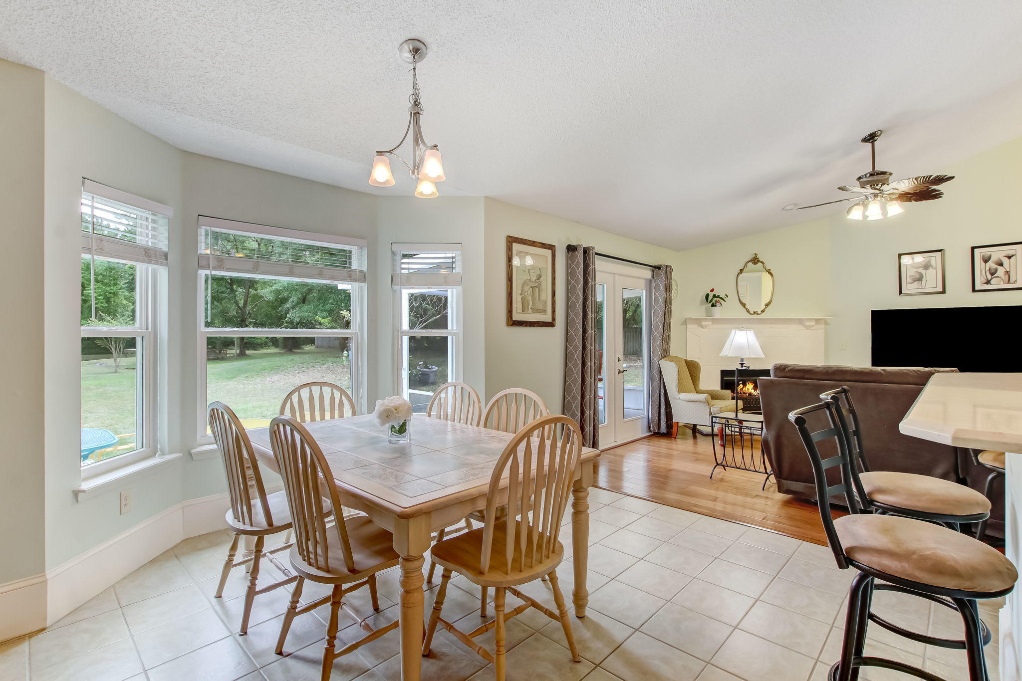 96450 Chester Road Yulee, FL 32097 - Photo 10 of 29 a dining room with furniture a chandelier and window