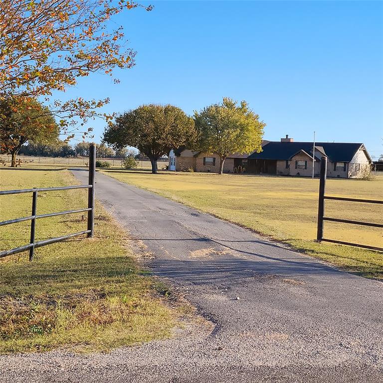 Set back from the road for privacy and full asphalt drive for all-weather access.
