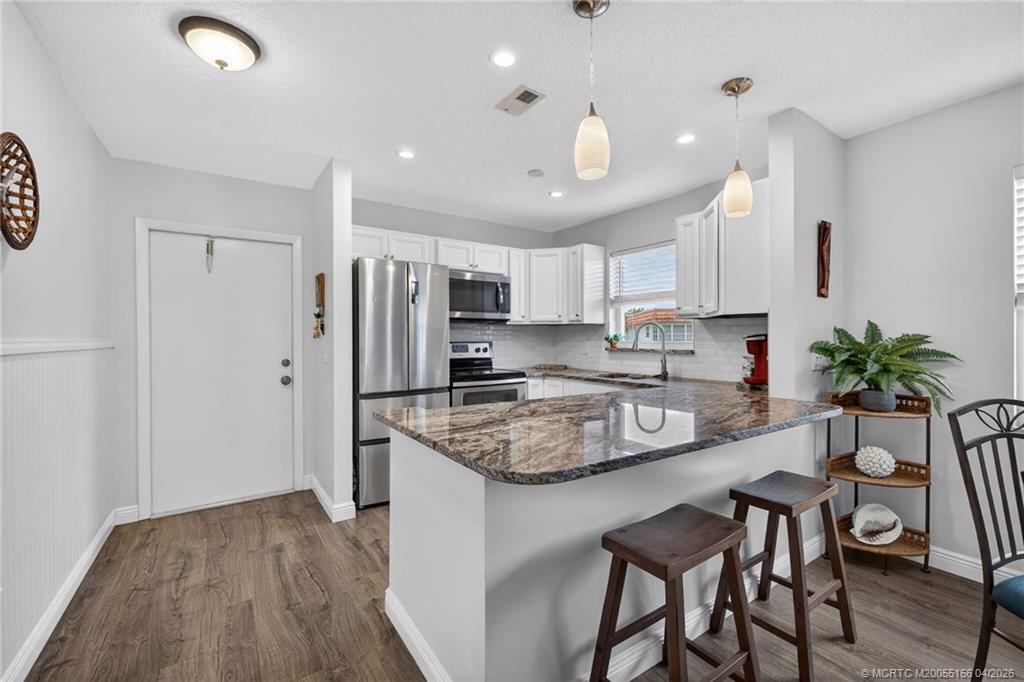 1225 Northwest 21st Street, Unit 2615 Stuart, FL 34994 - Photo 1 of 43 Modern updated kitchen with recessed lighting.