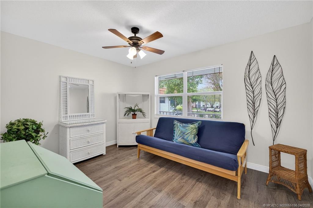 1225 Northwest 21st Street, Unit 2615 Stuart, FL 34994 - Photo 11 of 43 Second bedroom, luxury vinyl flooring and impact window.
