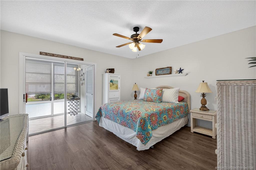 1225 Northwest 21st Street, Unit 2615 Stuart, FL 34994 - Photo 19 of 43 Primary bedroom with sliders to the enclosed lanai.