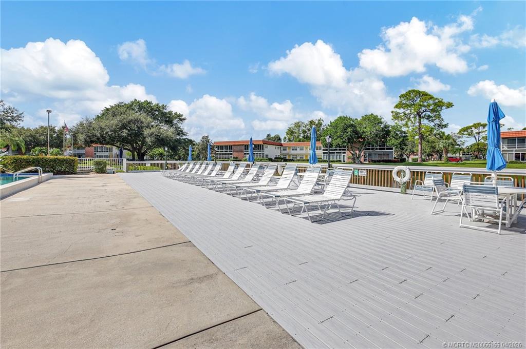 1225 Northwest 21st Street, Unit 2615 Stuart, FL 34994 - Photo 32 of 43 Poolside at Vista del Lago.