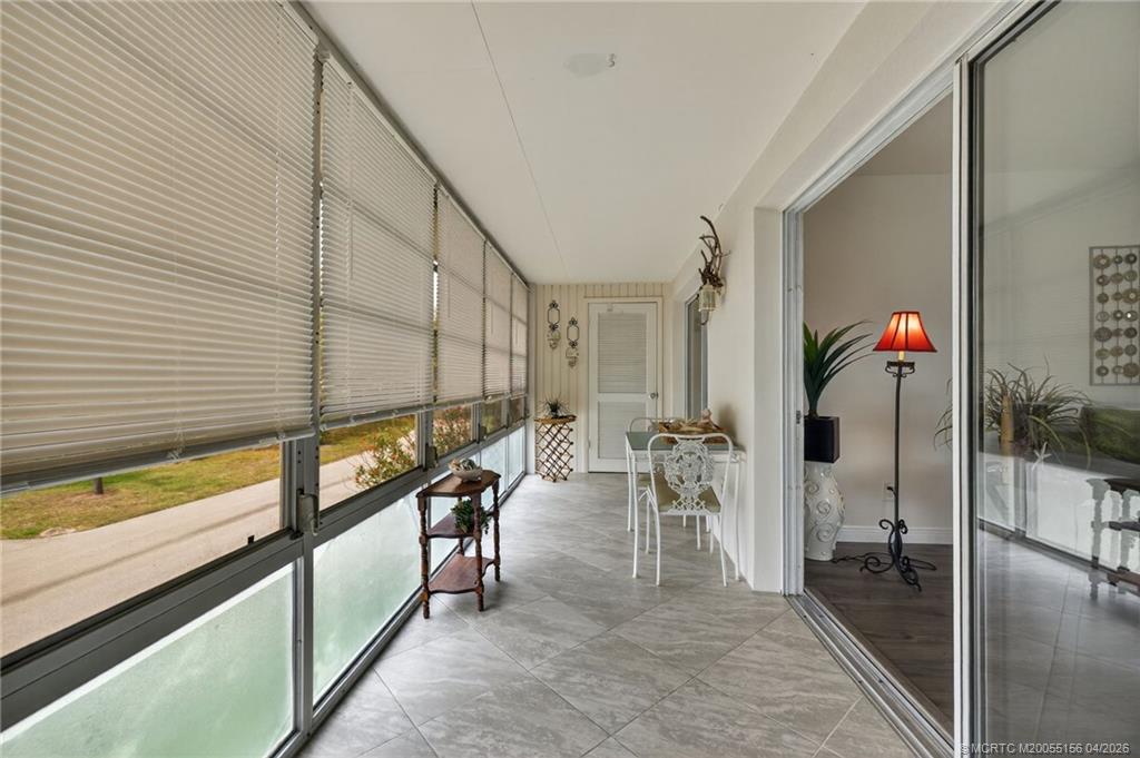 1225 Northwest 21st Street, Unit 2615 Stuart, FL 34994 - Photo 9 of 43 Enjoy a breeze from the balcony just off the living room.