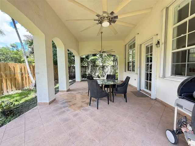 a view of a dining room with furniture window and outside view