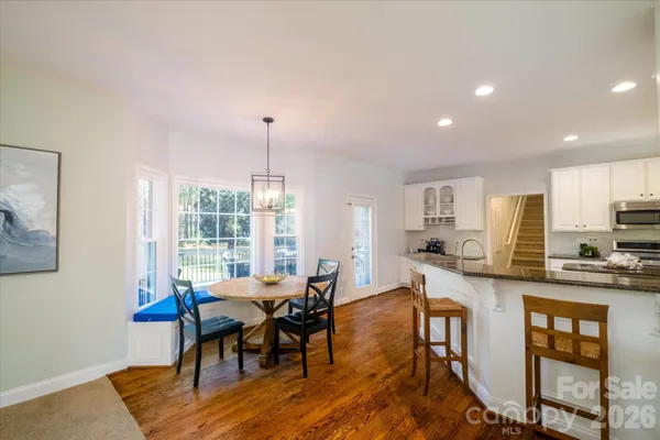 a view of a dining room with furniture window and outside view