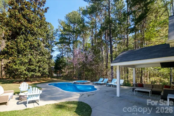 a view of a backyard with sitting area
