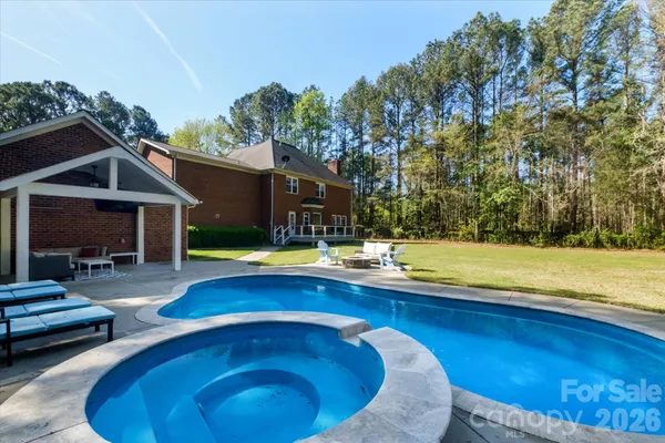 a view of swimming pool with lounge chair