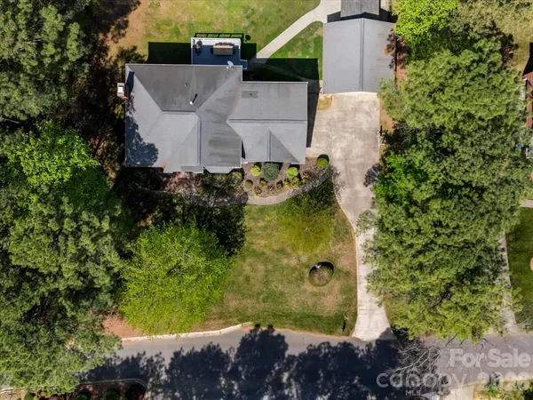 an aerial view of a house with a garden
