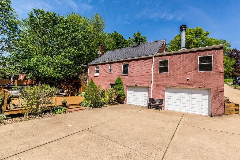 422 Thompsonville Road McMurray, PA 15317 - Photo 21 of 25 Two car garage with oversized bay plus brand new garage doors on both. Generous amount of parking.