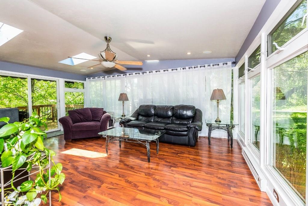 422 Thompsonville Road McMurray, PA 15317 - Photo 10 of 25 WOW . . . this family (4 season room) is huge, awesome and full of natural light provided by walls of windows, skylights and features Pergo flooring.