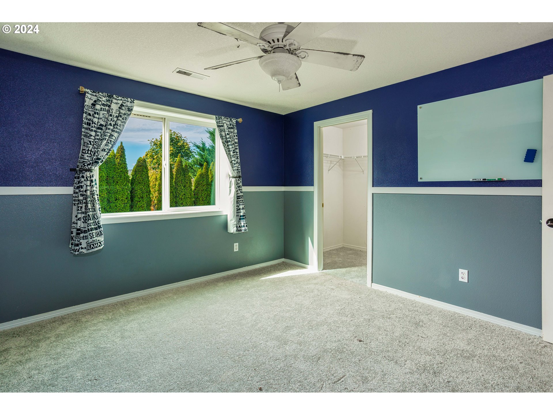 633 North 18th Place Ridgefield, WA 98642 - Photo 26 of 31 a view of empty room with window ceiling fan and carpet