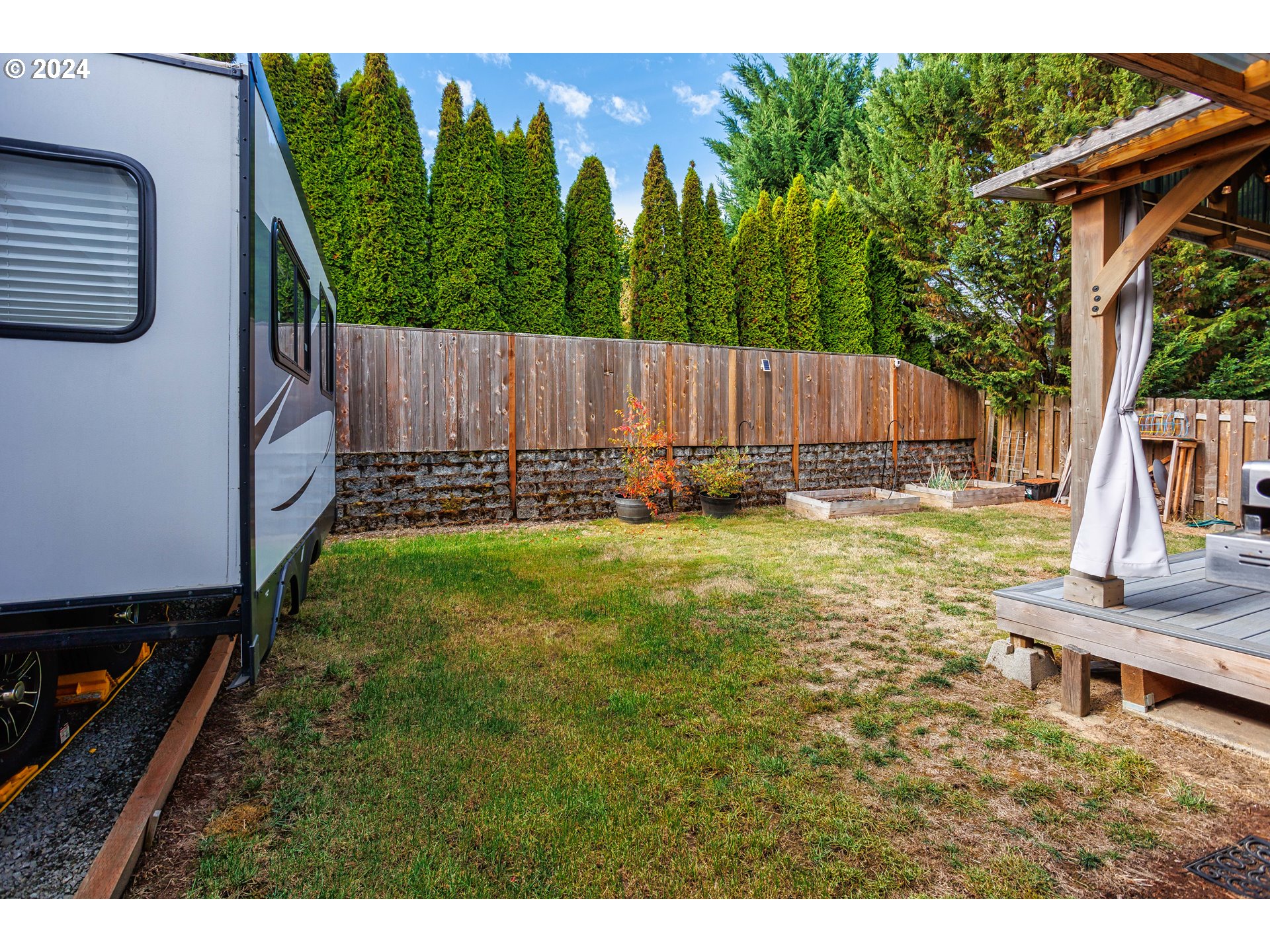 633 North 18th Place Ridgefield, WA 98642 - Photo 28 of 31 a backyard of a house with lots of green space