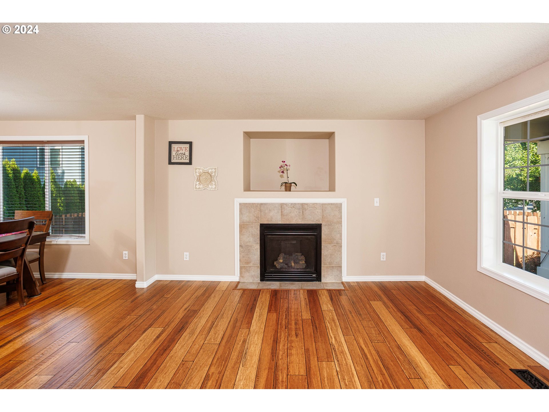 633 North 18th Place Ridgefield, WA 98642 - Photo 8 of 31 a view of an empty room with window and wooden floor