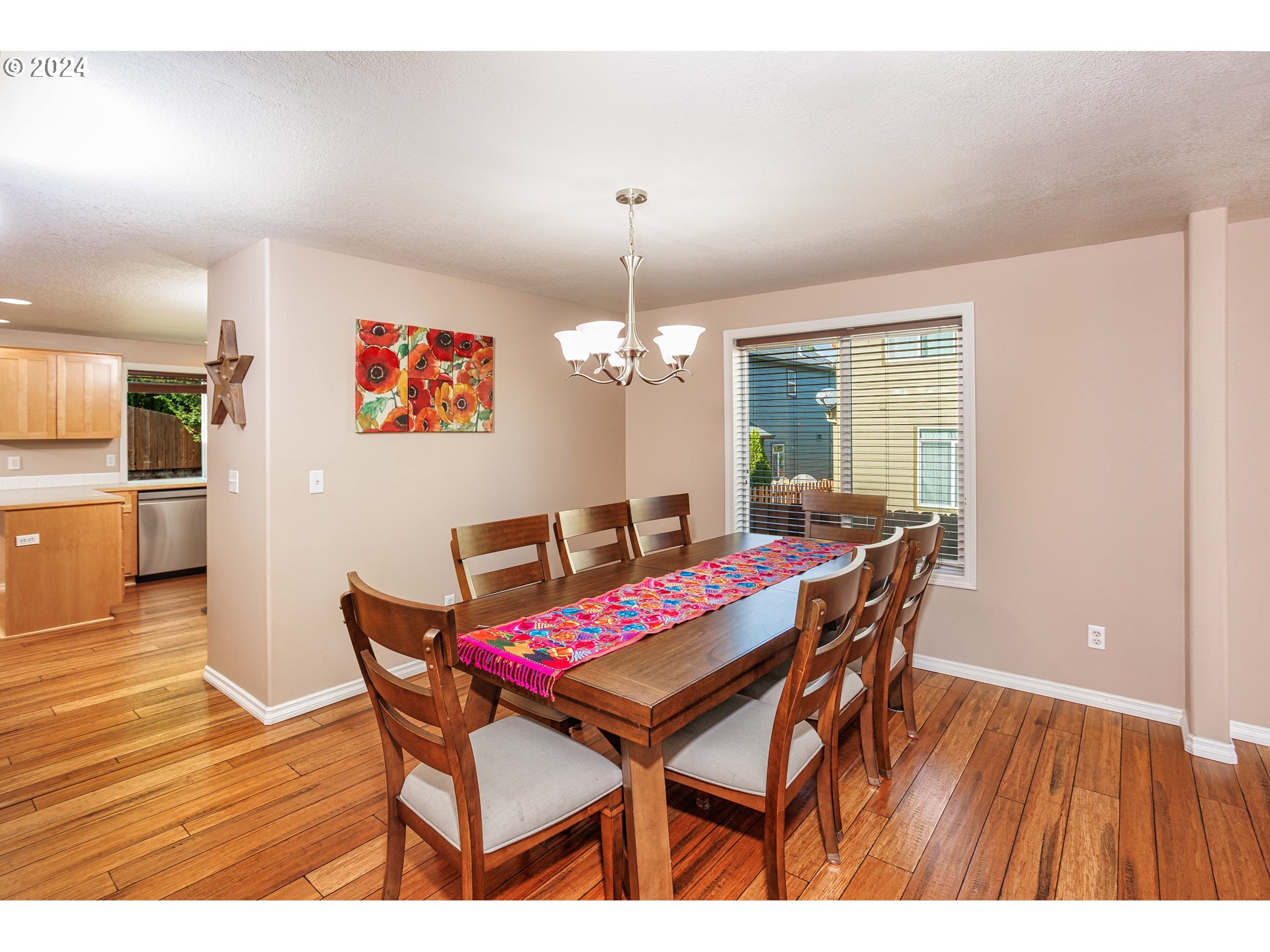 633 North 18th Place Ridgefield, WA 98642 - Photo 9 of 31 a view of a dining room with furniture and wooden floor