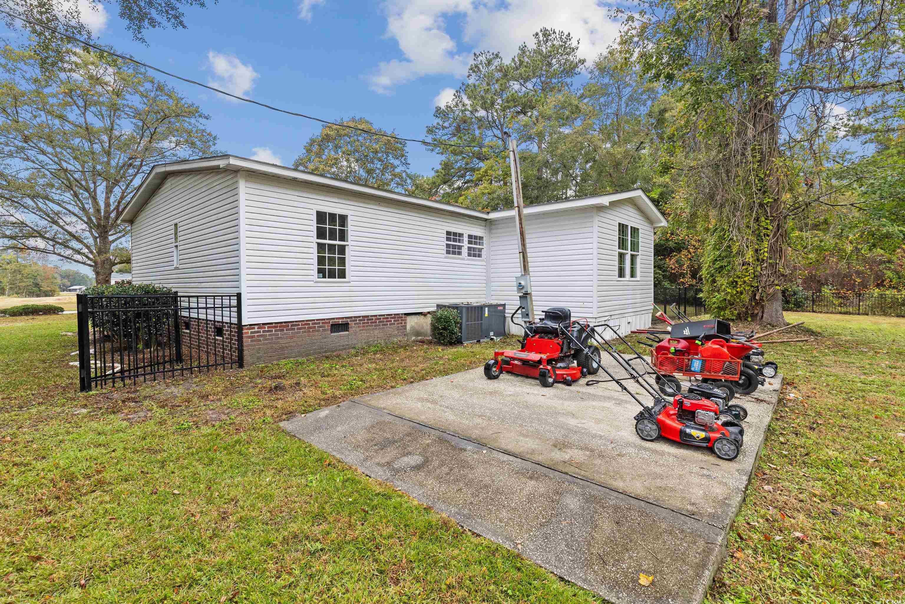 3106 Dog Bluff Road Aynor, SC 29511 - Photo 24 of 27 Rear view of house featuring a lawn and crawl space