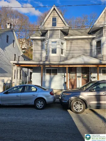 a car parked in front of a house