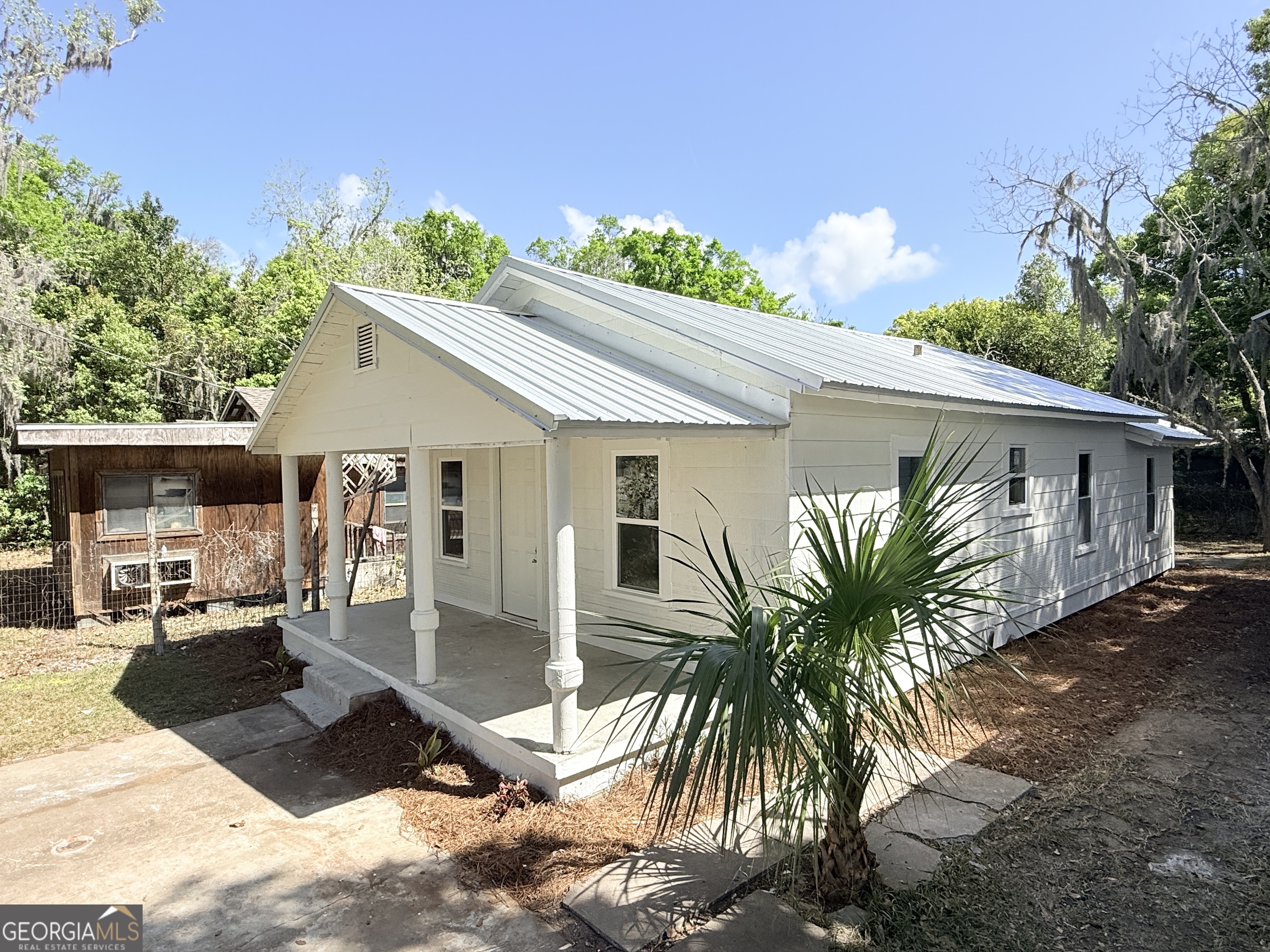 2416 Union Street Brunswick, GA 31520 - Photo 2 of 12 a front view of a house with garden