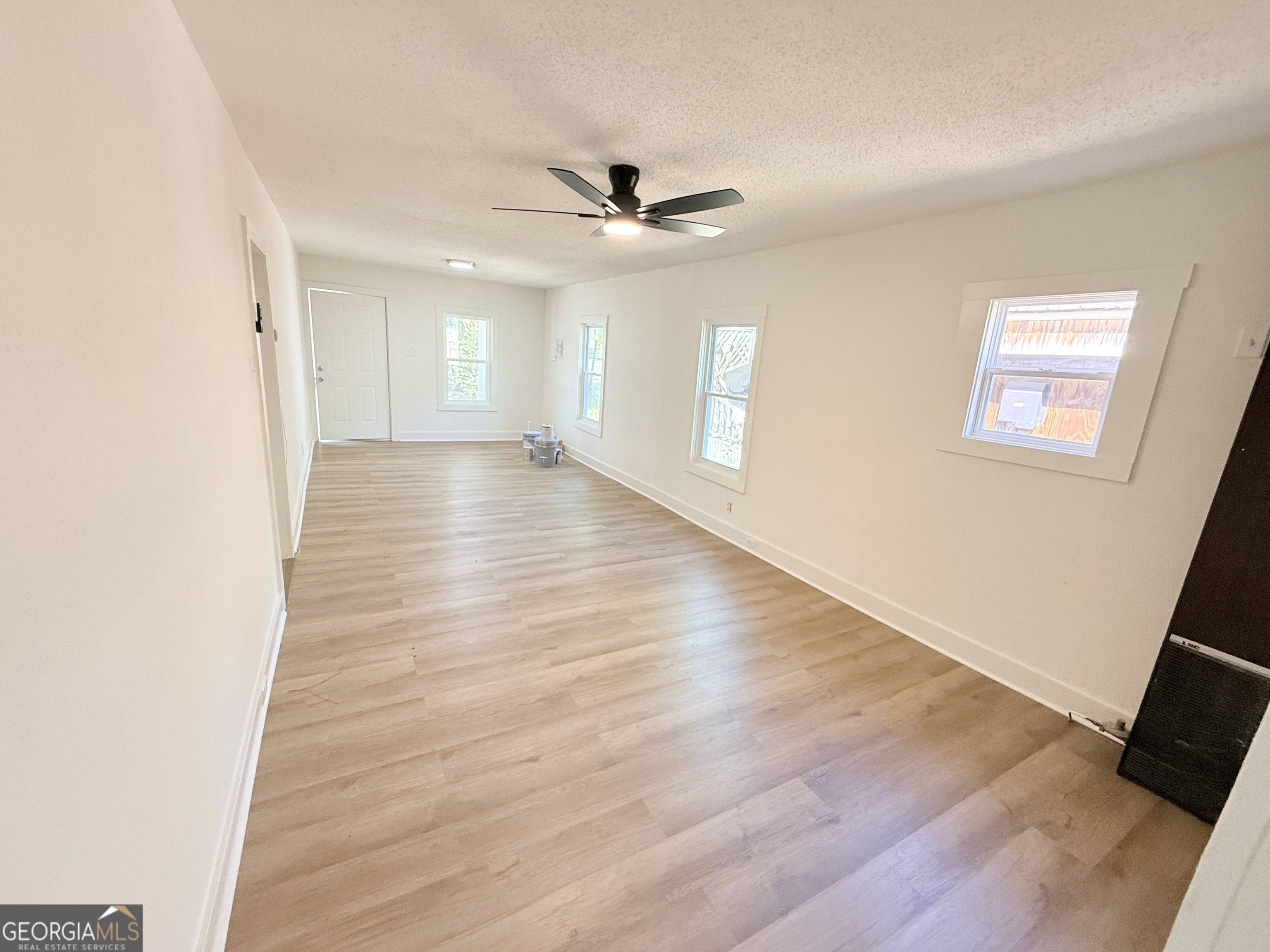 2416 Union Street Brunswick, GA 31520 - Photo 3 of 12 wooden floor in an empty room with a window