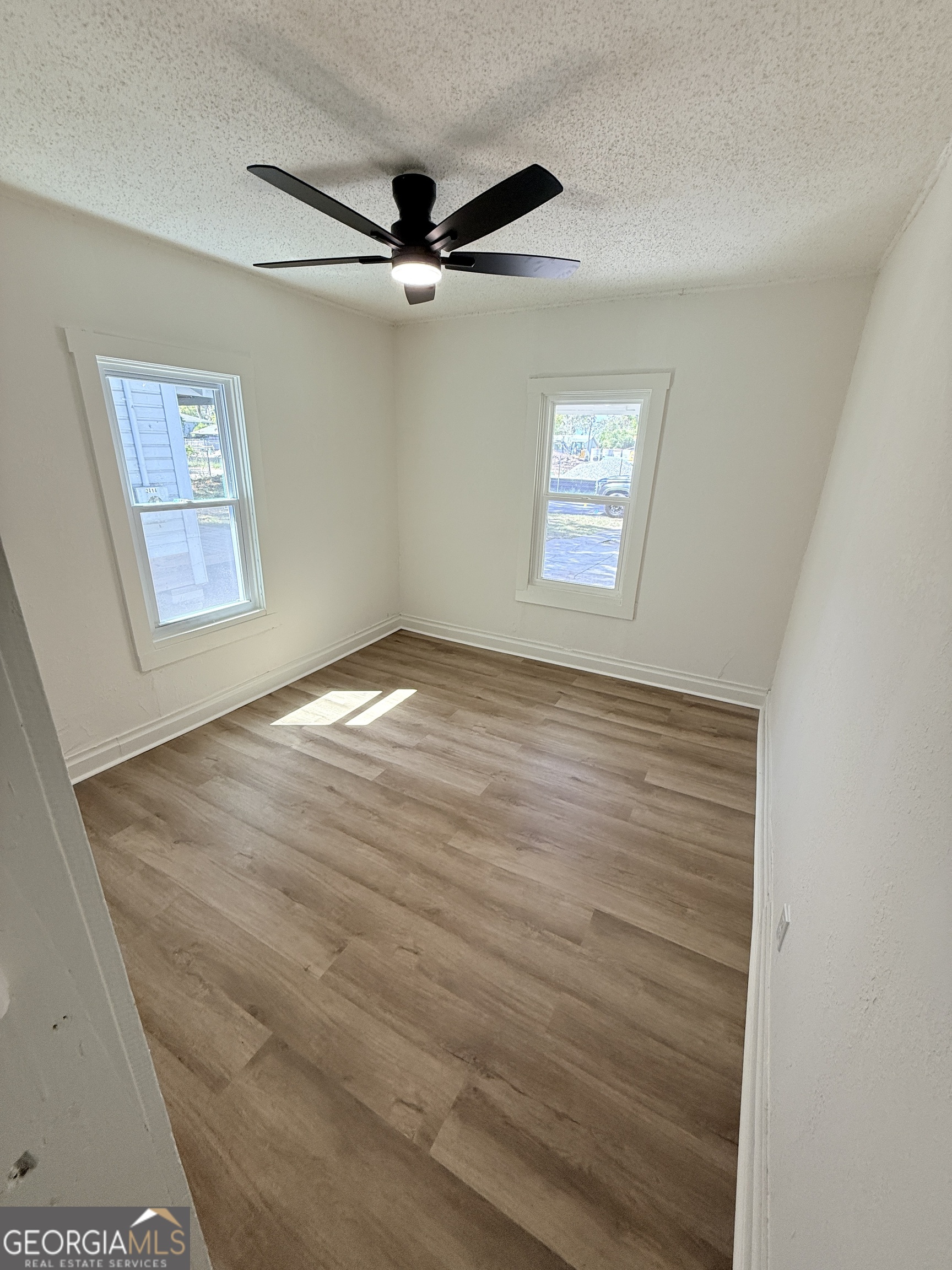 2416 Union Street Brunswick, GA 31520 - Photo 4 of 12 a view of an empty room with a window