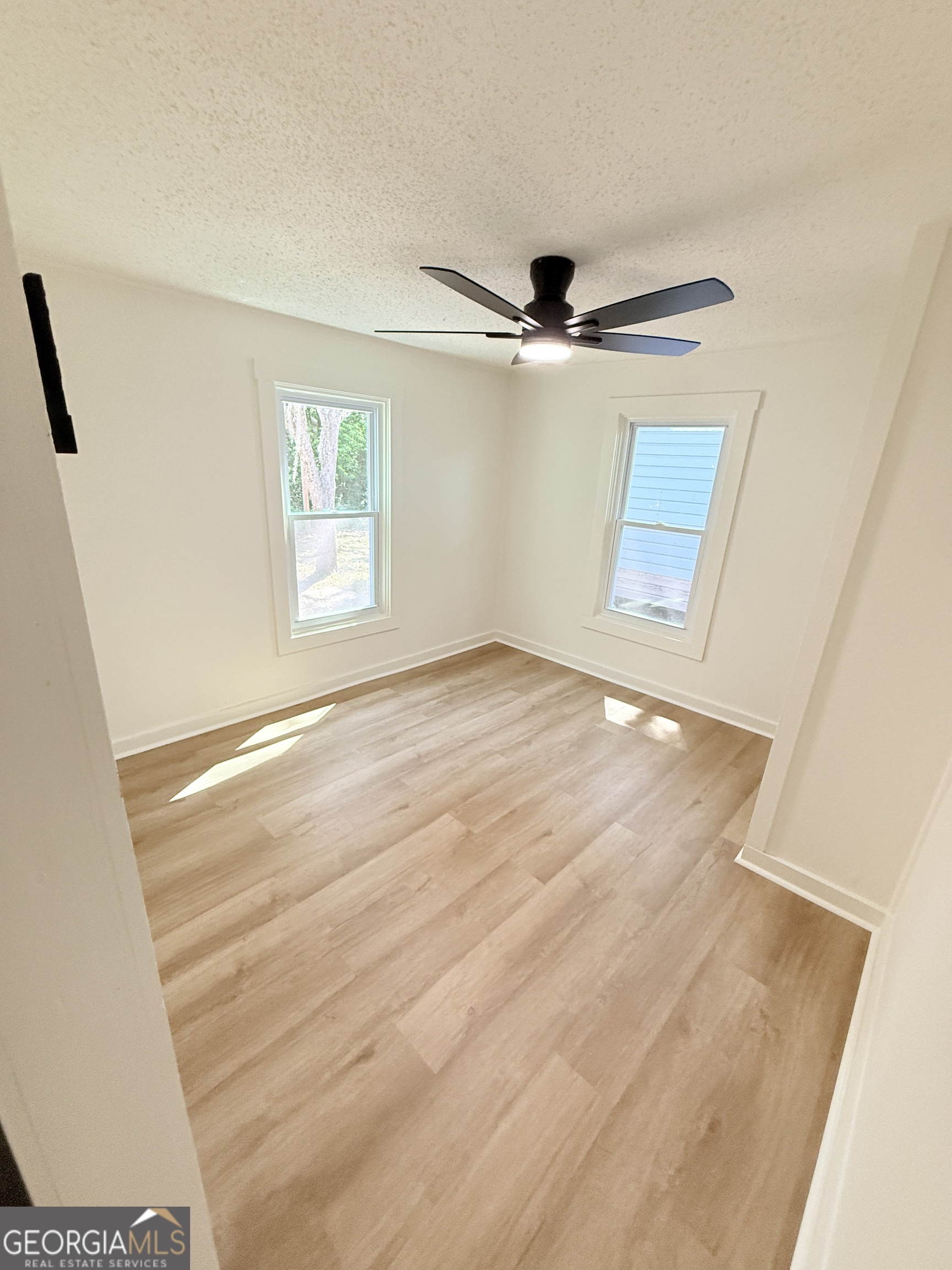2416 Union Street Brunswick, GA 31520 - Photo 5 of 12 a view of an empty room with a window