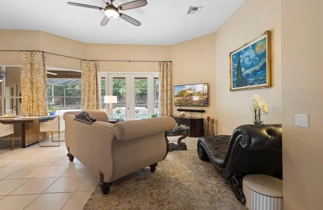 a living room with furniture and a window