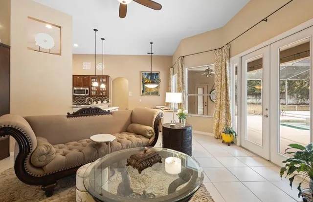 a living room with furniture and a large window