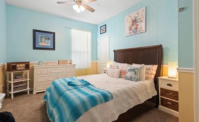 a bedroom with a bed and a dresser