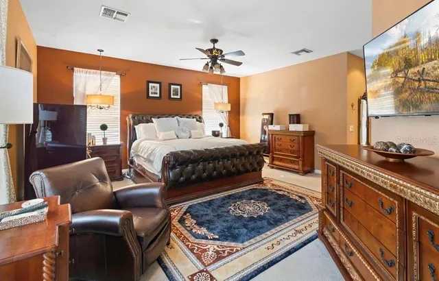 a bed room with a bed window and a dresser