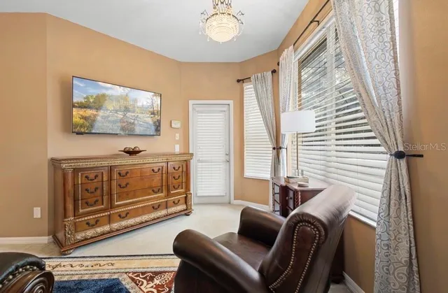 a bedroom with furniture and a window