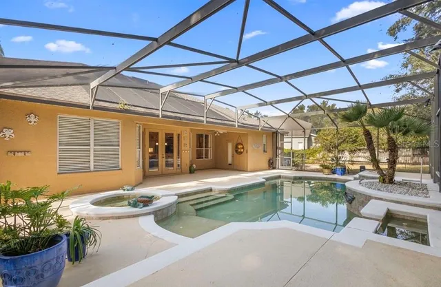 a house view with a sitting space and glass windows