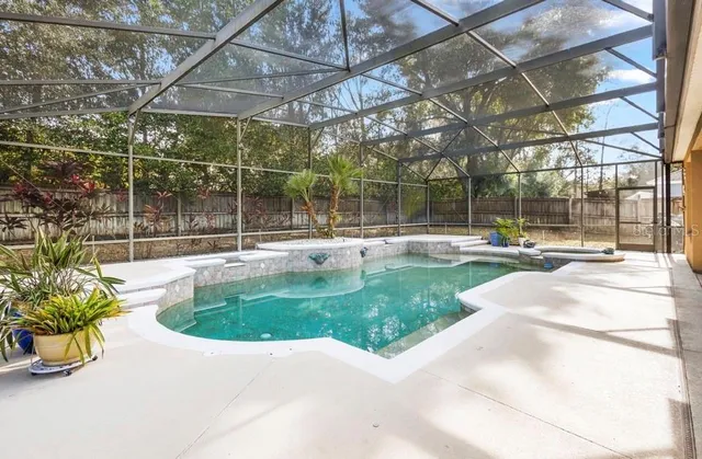 a view of a swimming pool with a patio
