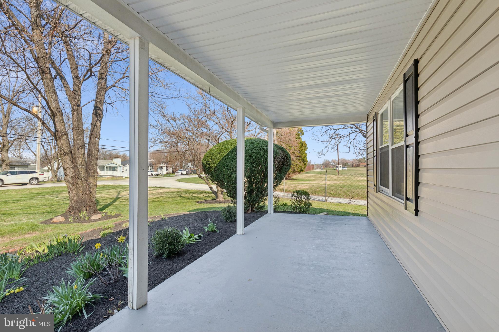 7451 Oakland Mills Road Columbia, MD 21046 - Photo 12 of 83 a view of a porch with furniture