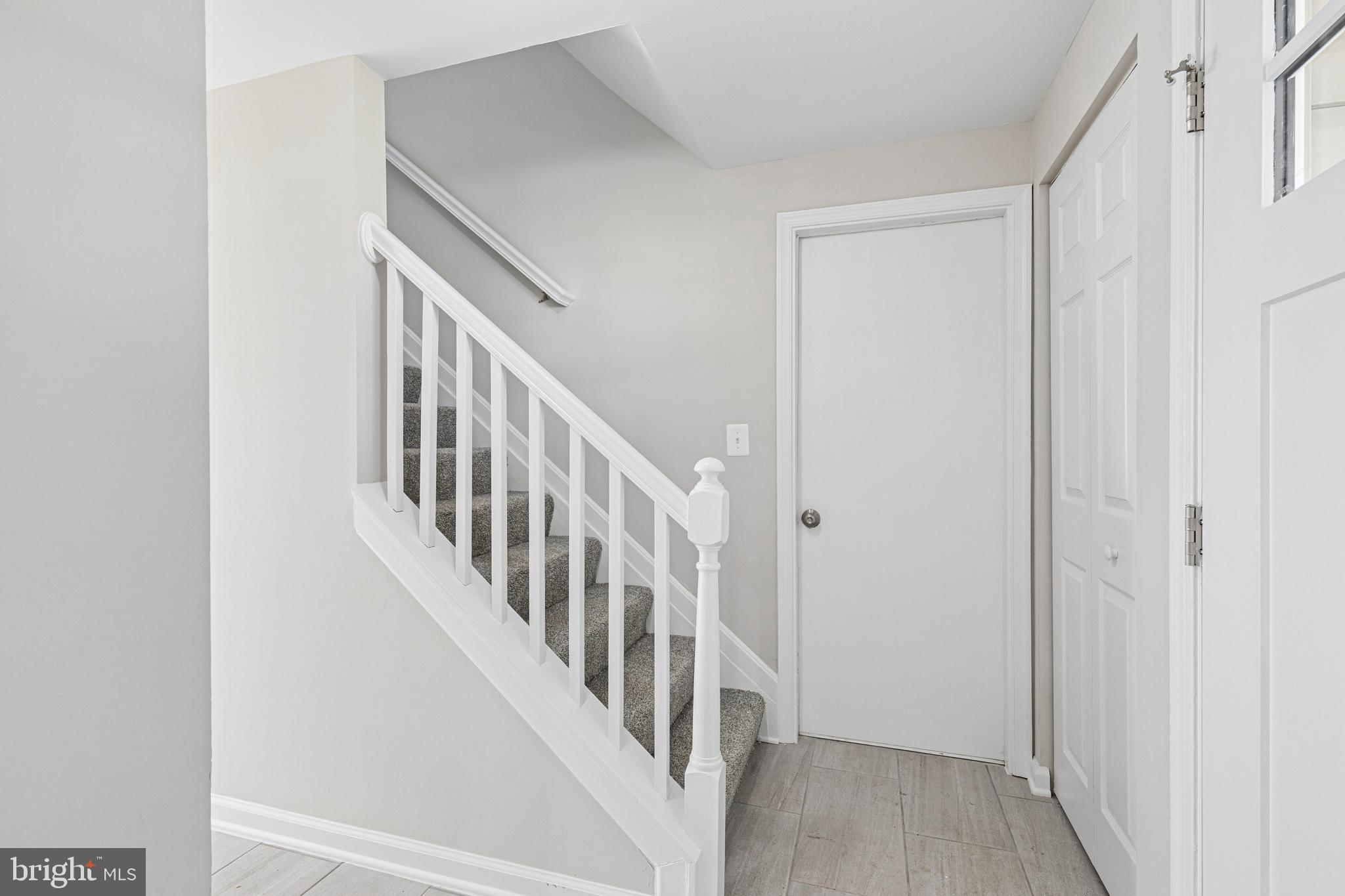 7451 Oakland Mills Road Columbia, MD 21046 - Photo 16 of 83 a view of an entryway with wooden floor