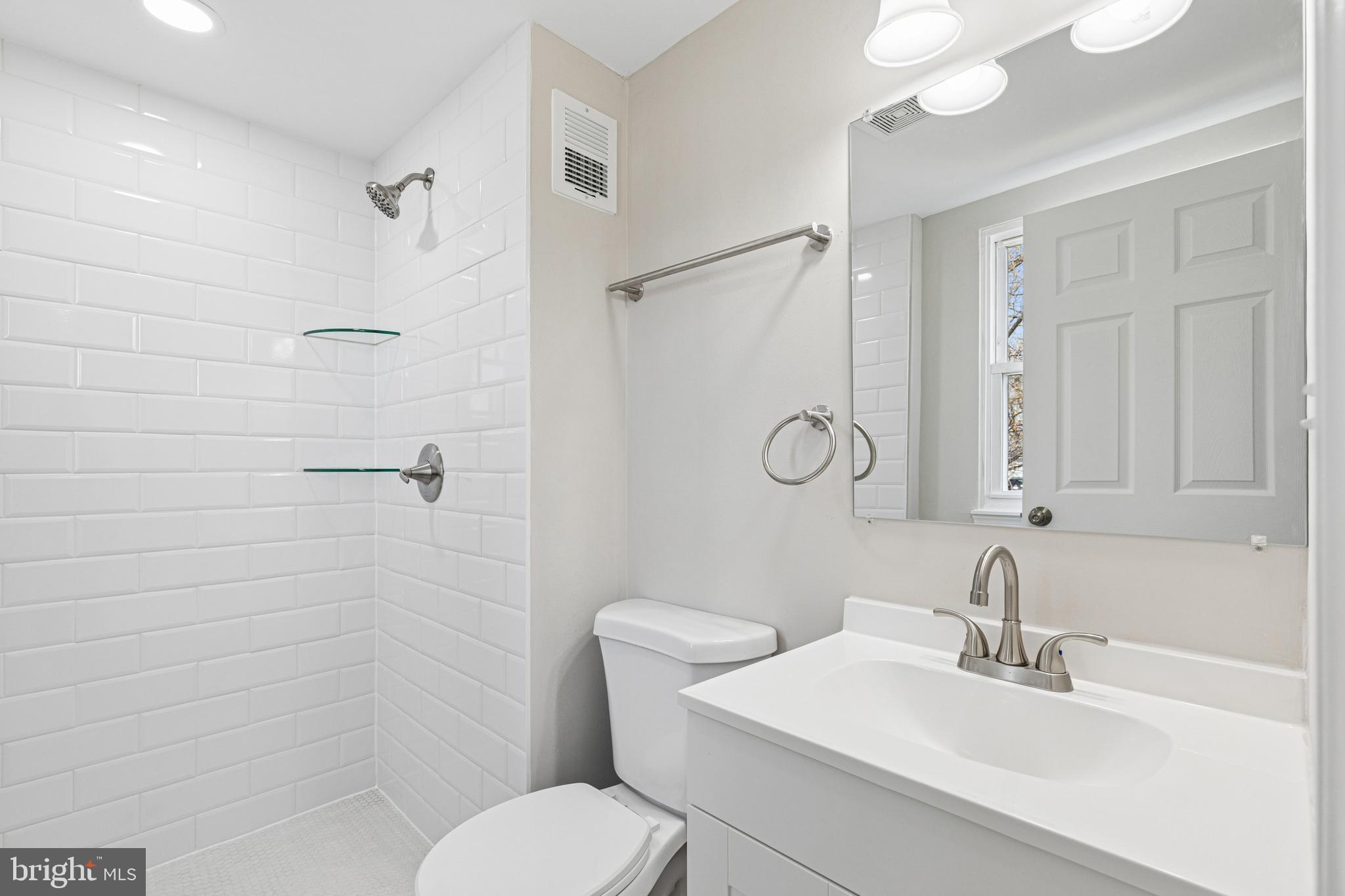 7451 Oakland Mills Road Columbia, MD 21046 - Photo 60 of 83 a bathroom with a sink toilet and shower